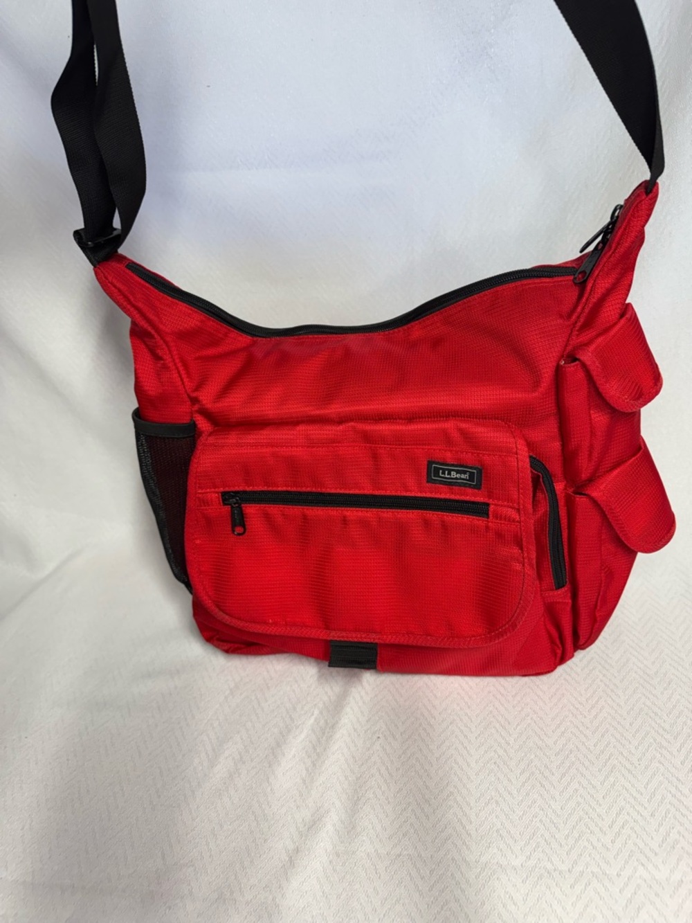 L.L. Bean Red Diaper Bag with changing pad. Lots of pockets and roomy